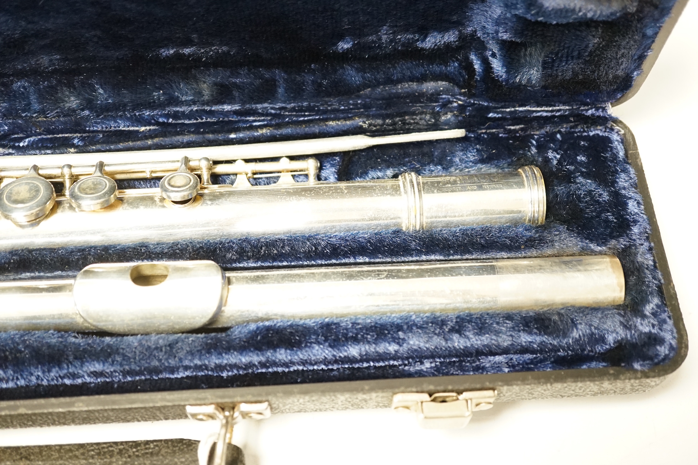 A cased Boosey and Hawkes 400 flute with closed hole key work